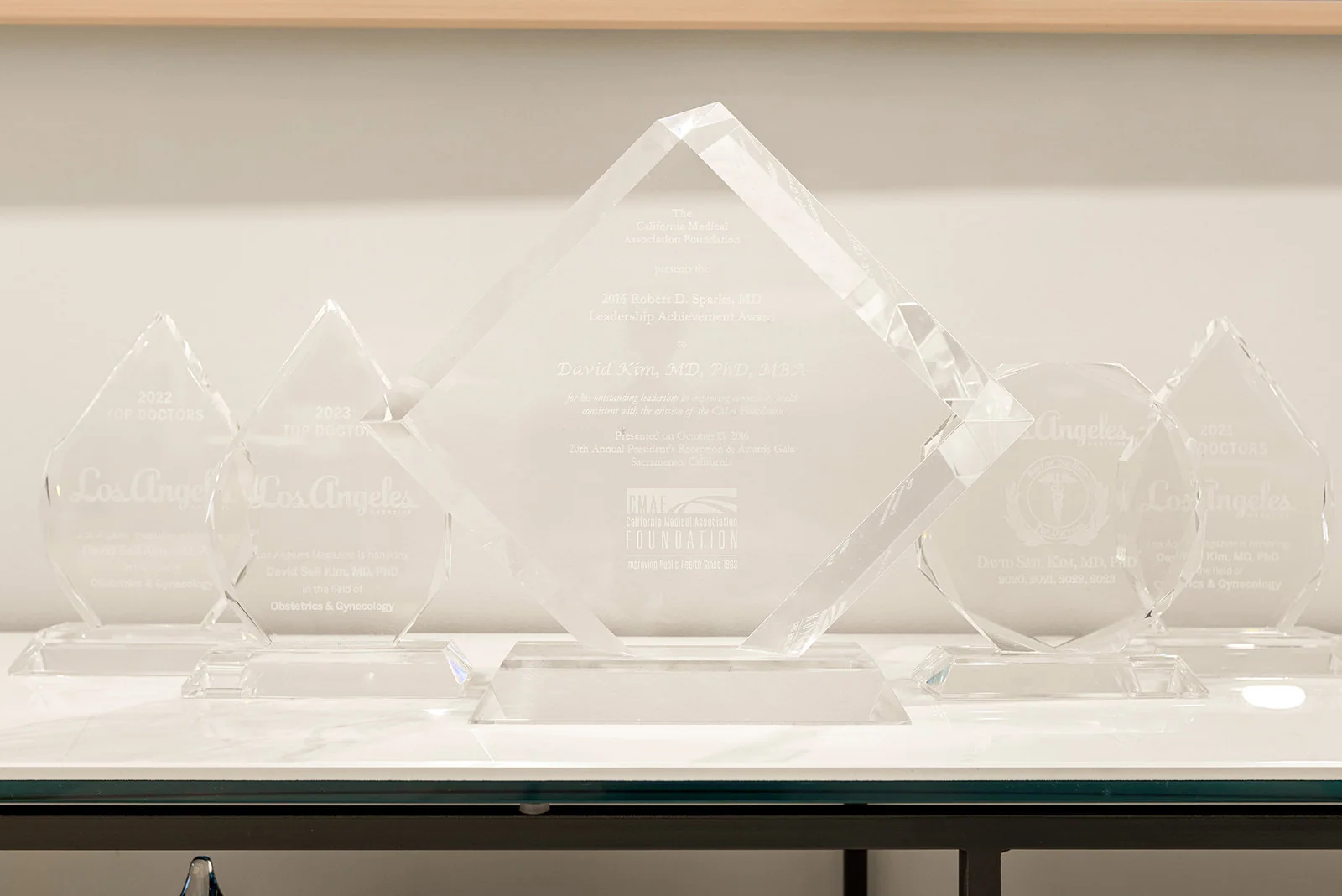 Crystal awards including the 2016 CMA Foundation Robert D. Sparks Leadership Achievement Award